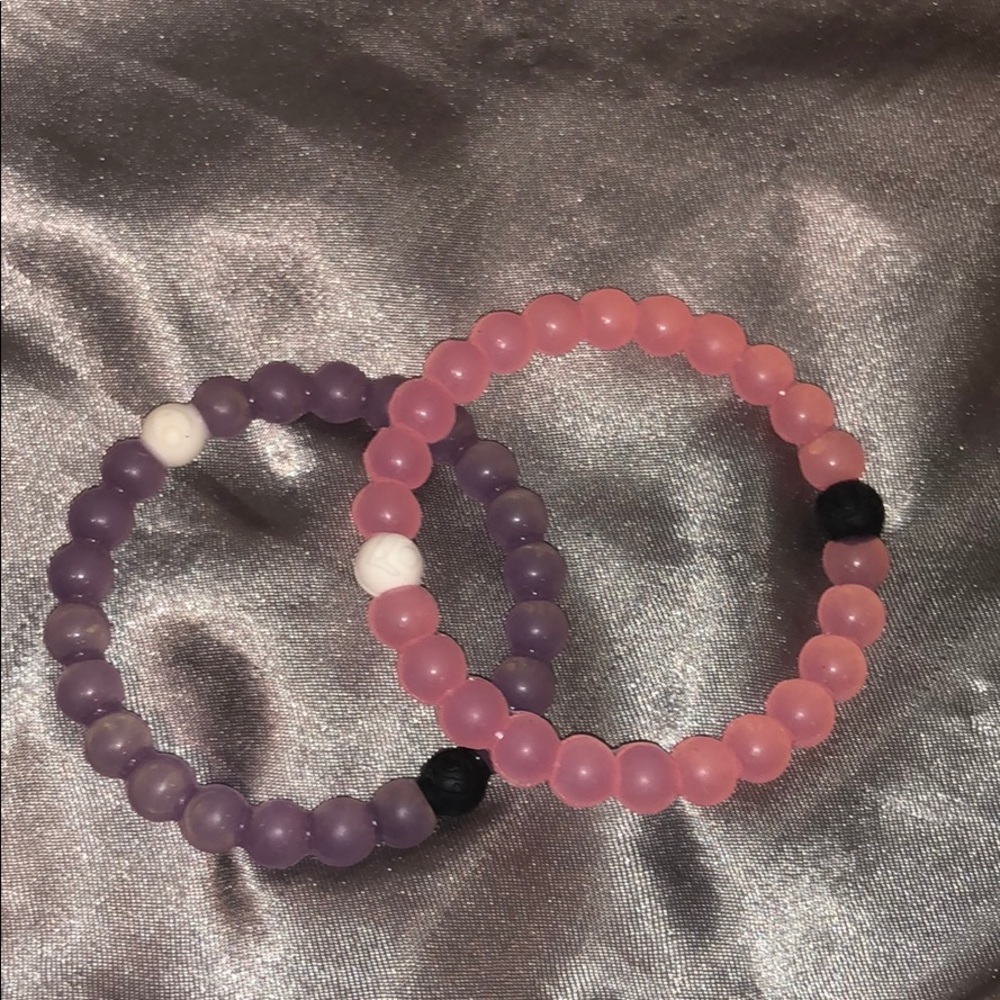 Pink and purple Lokai bracelets